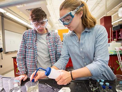 Two students working in a science laboratory 